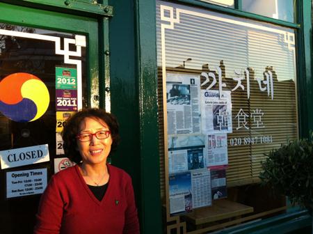 Hyeon-ja Jo, a 25-year resident of the U.K., stands outside her restaurant Cah Chi in the Raynes Park area of Greater London. (Photos courtesy of Niels Footman)